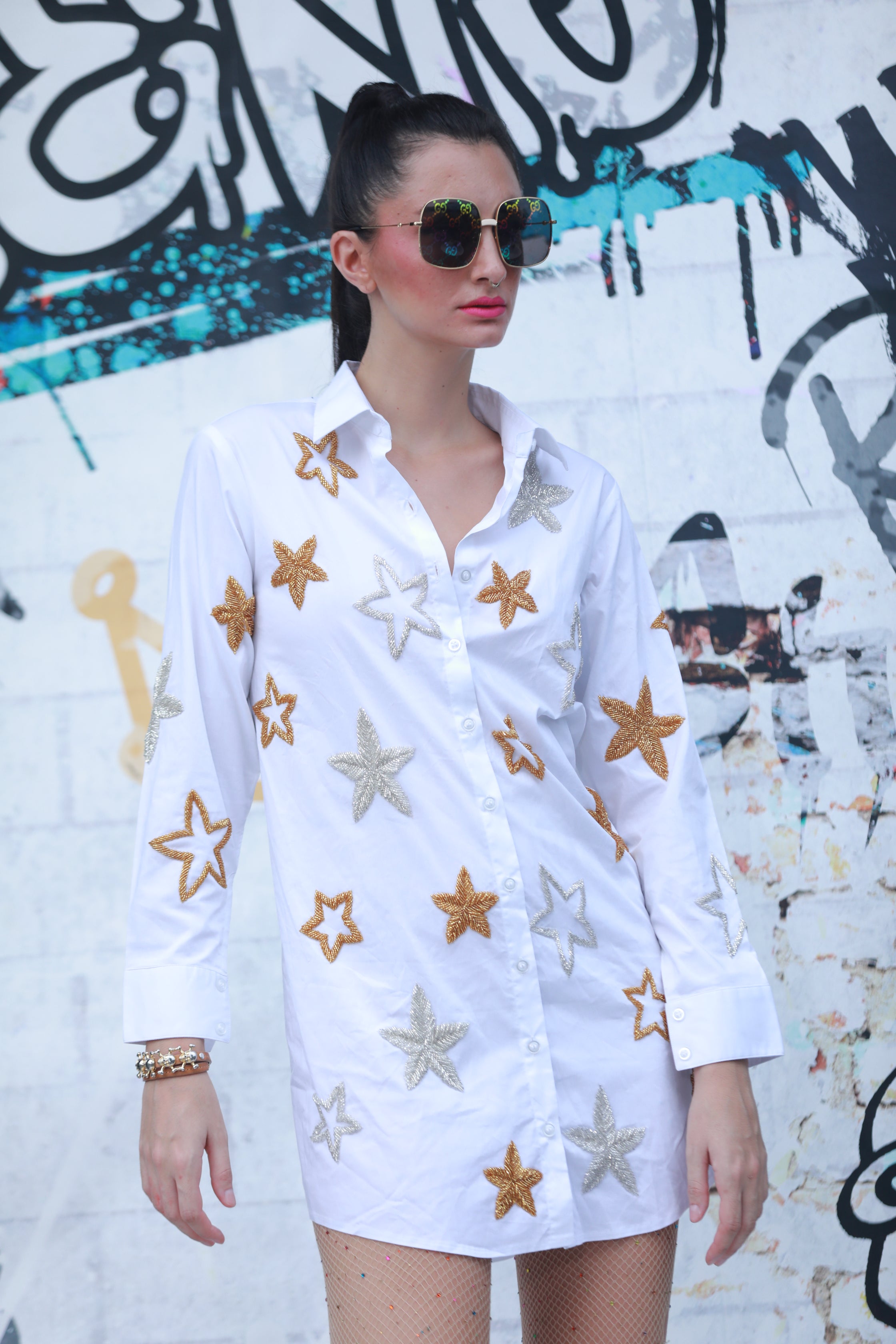 White shirt with gold and silver stars all over